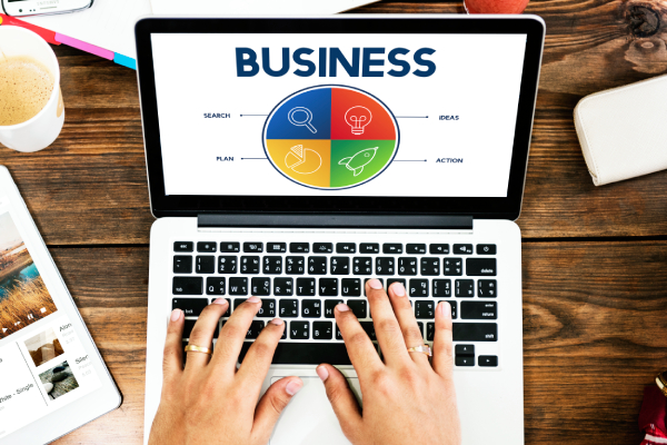 Person managing Google Business Profile on laptop, ensuring NAP consistency for better local SEO visibility.