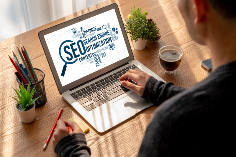 Person optimizing website for SEO to improve crawlability and indexability.